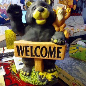 very cute welcome bear garden statue.